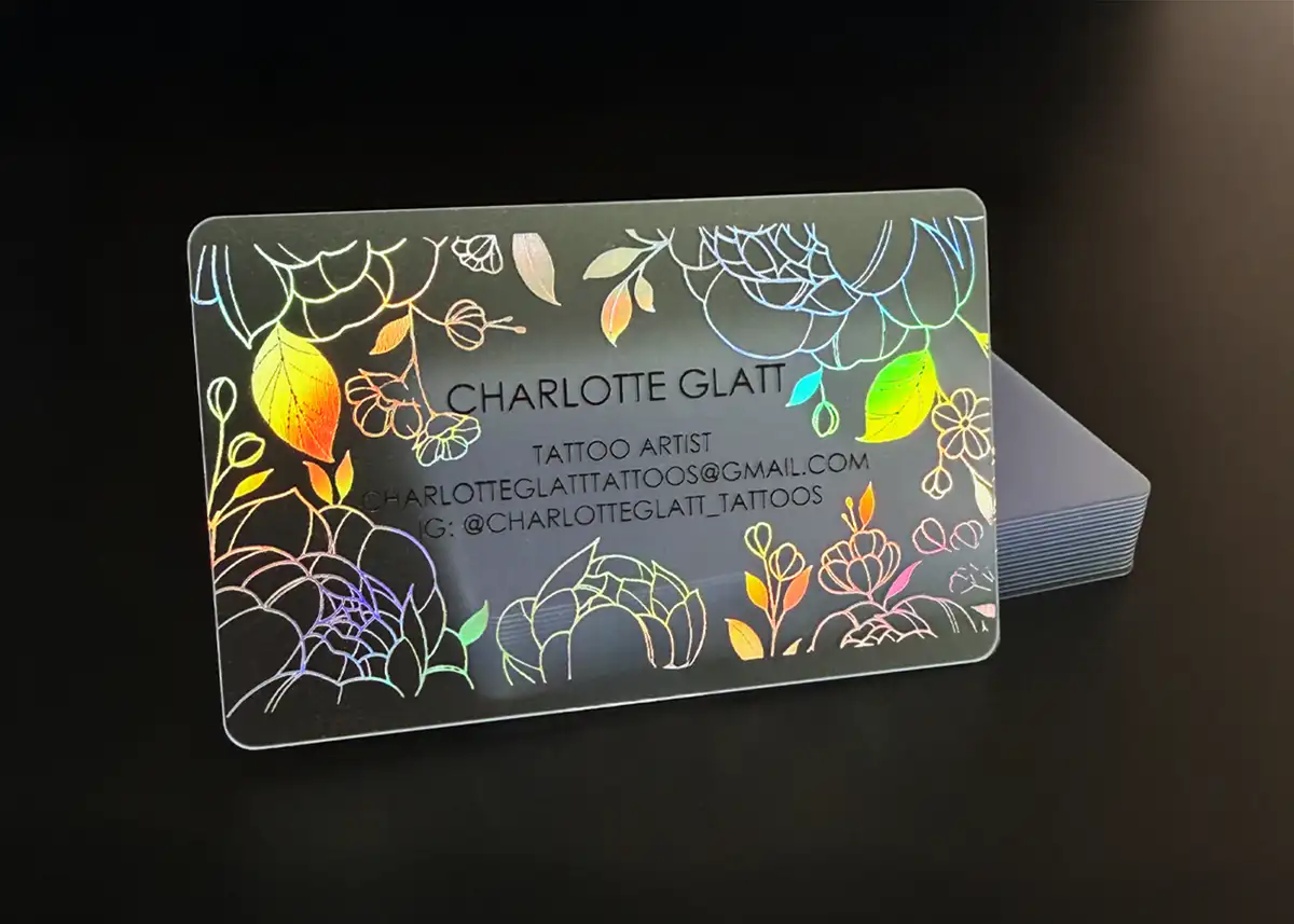a frosted plastic card printed with holoprint foil for a beautiful intricate flower design plus black ink for the contact details