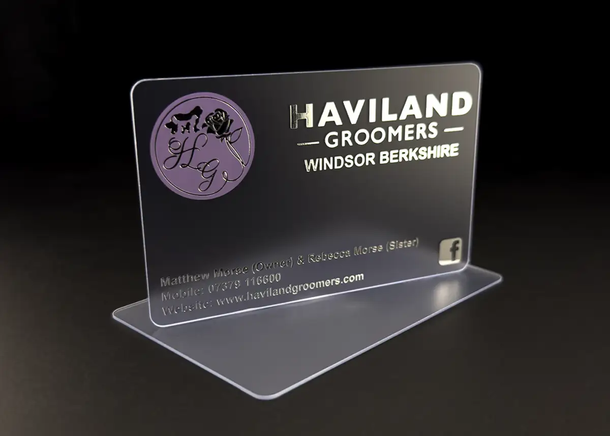 a frosted plastic card printed with purple and metallic silver foil