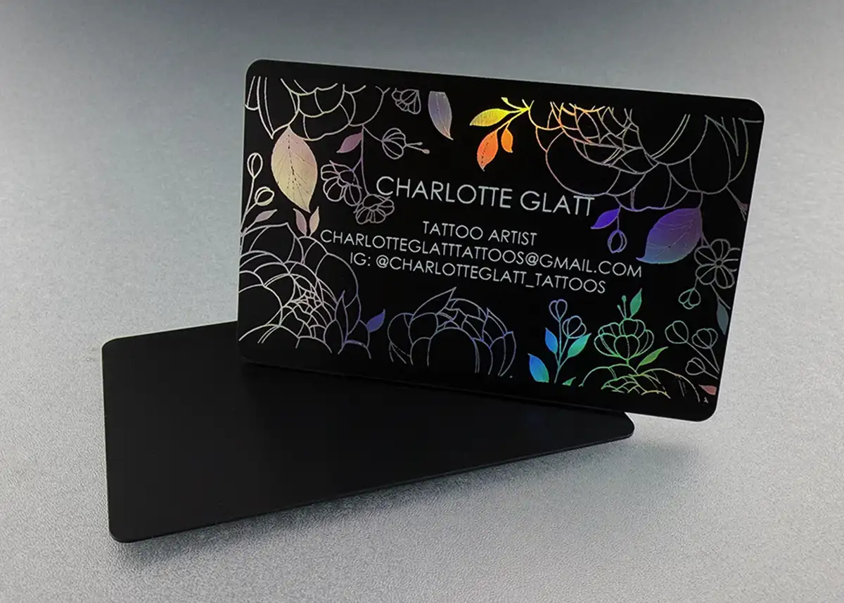 a satin black plastic card printed with holoprint foil