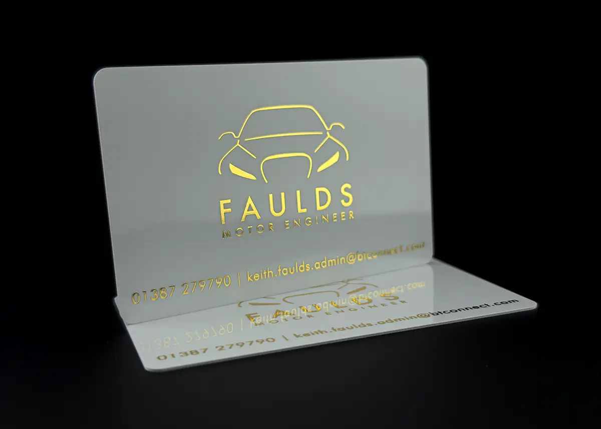 a white plastic card hot foil printed with metallic gold foil